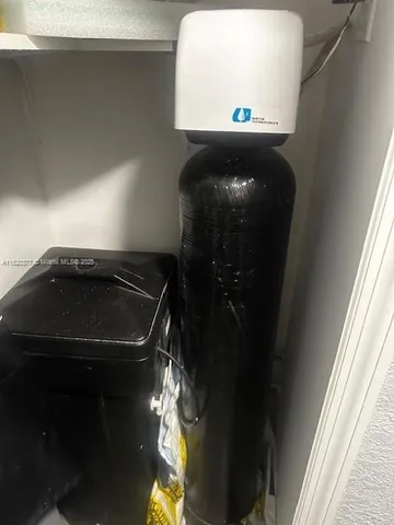 a bathroom with a toilet mirror vanity and window