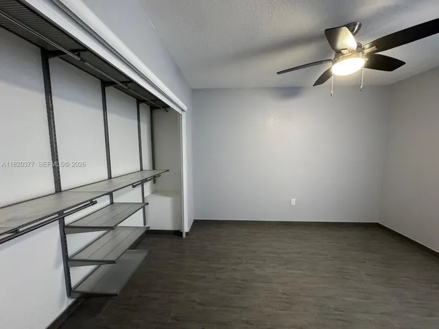 a kitchen with a sink cabinets and window