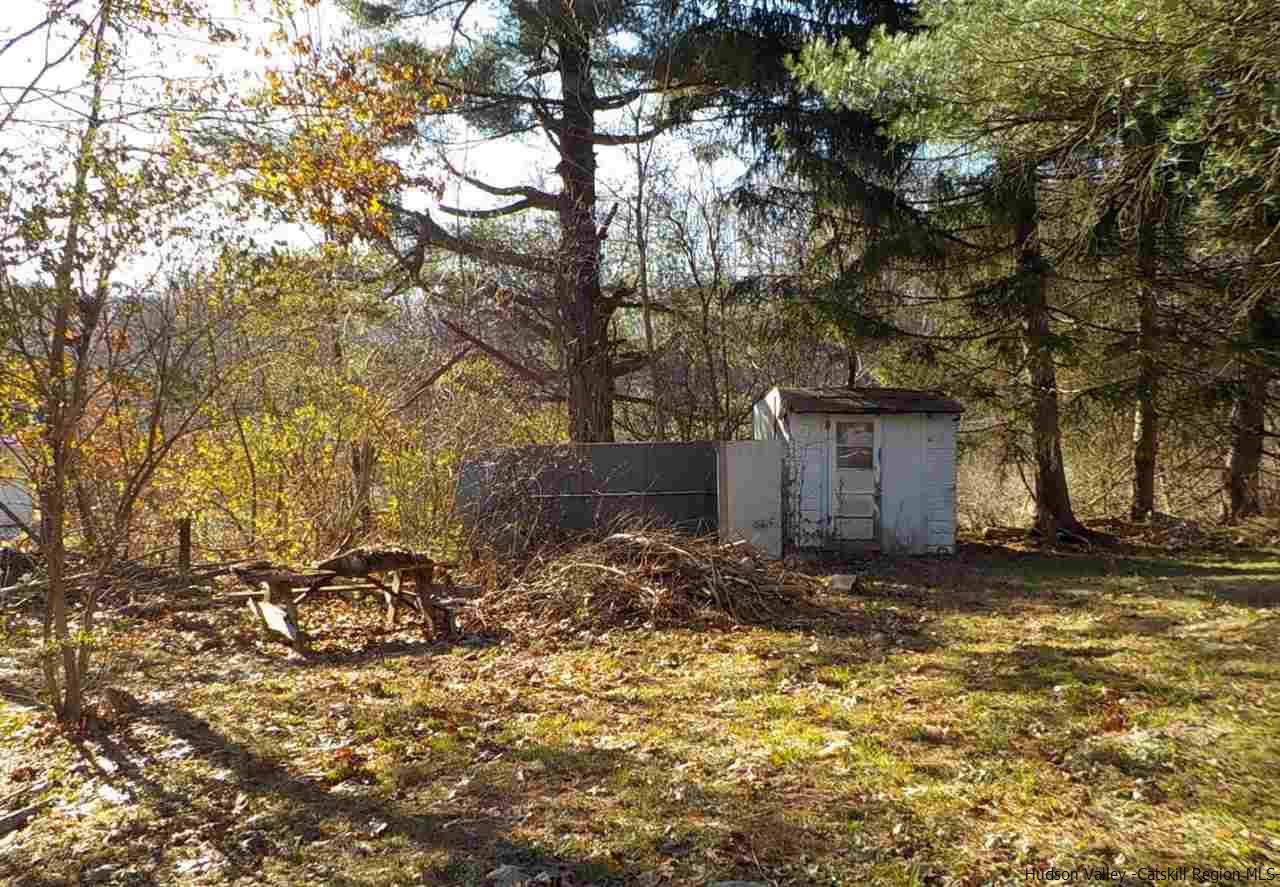 176 Beaver Road Red Hook, NY 12571 - Photo 11 of 12 a view of a barn in the middle of a yard