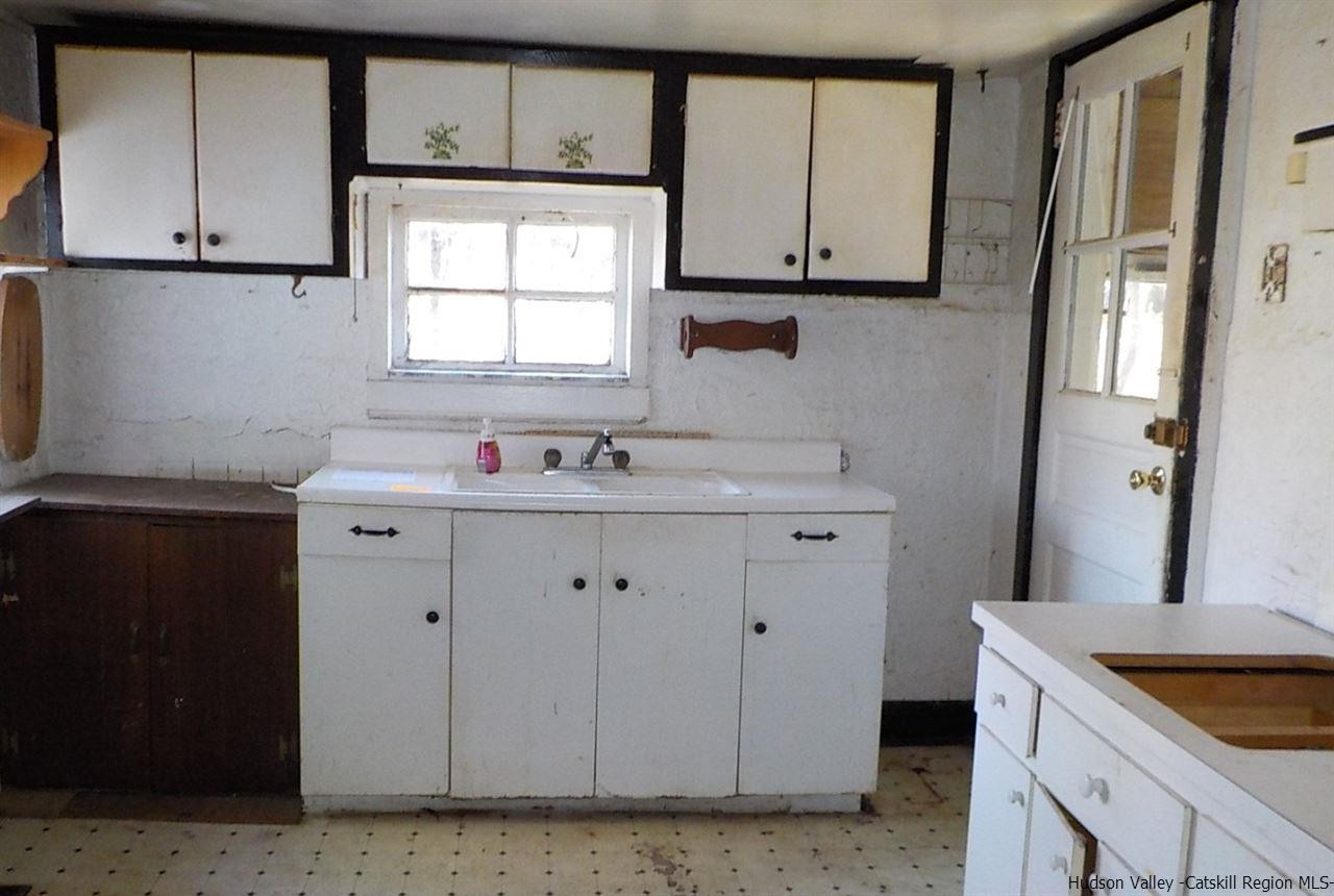 176 Beaver Road Red Hook, NY 12571 - Photo 2 of 12 a room with cabinets appliances