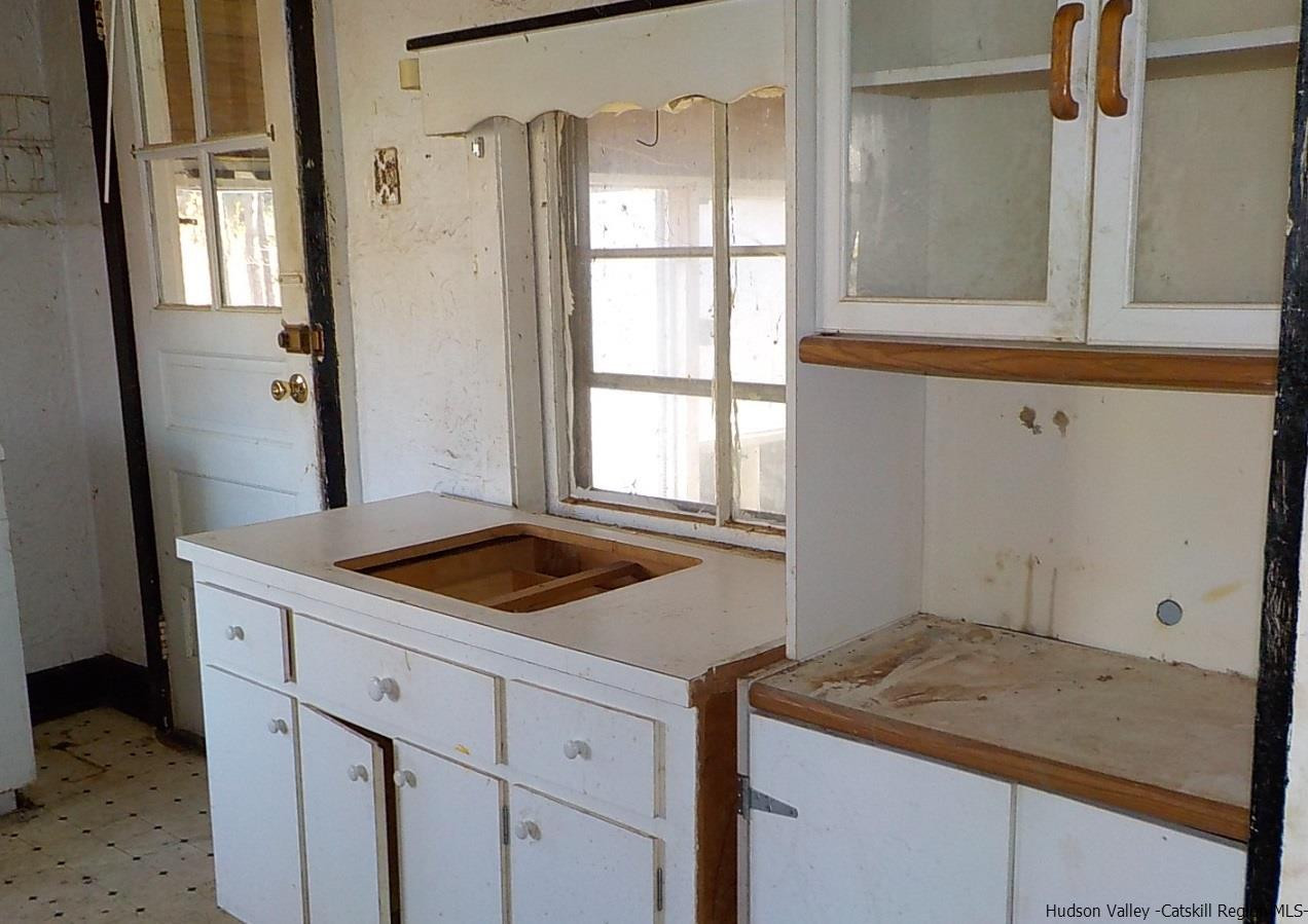 176 Beaver Road Red Hook, NY 12571 - Photo 3 of 12 a bathroom with a granite countertop sink and mirror