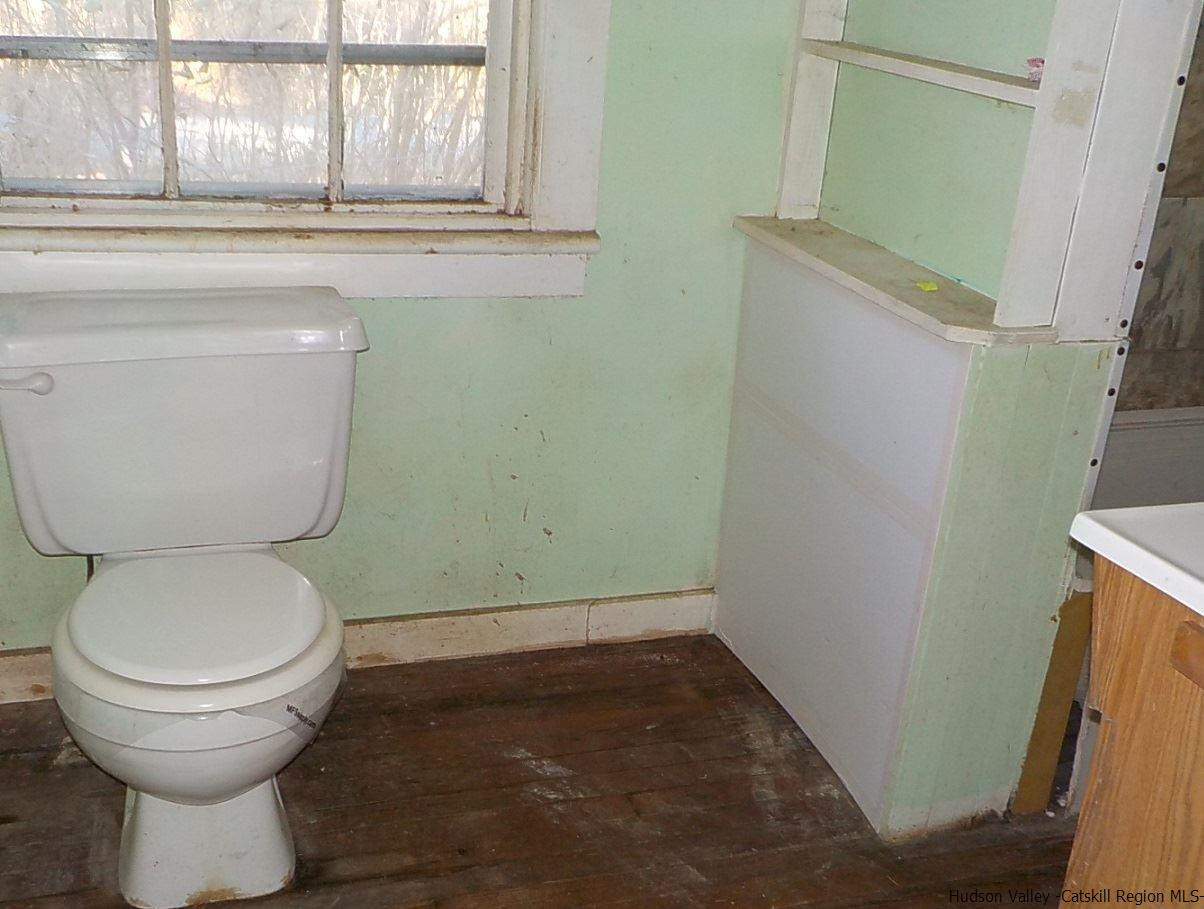 176 Beaver Road Red Hook, NY 12571 - Photo 5 of 12 a bathroom with a toilet and a sink