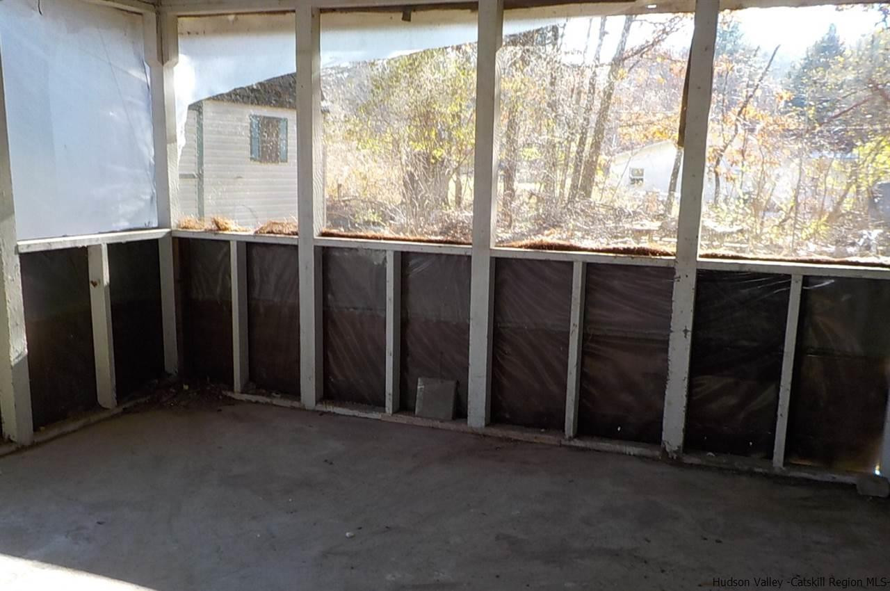 176 Beaver Road Red Hook, NY 12571 - Photo 8 of 12 a view of an empty room with balcony