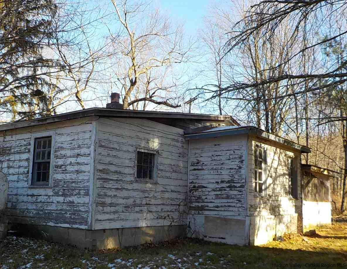 176 Beaver Road Red Hook, NY 12571 - Photo 9 of 12 a view of a stone house with a large tree