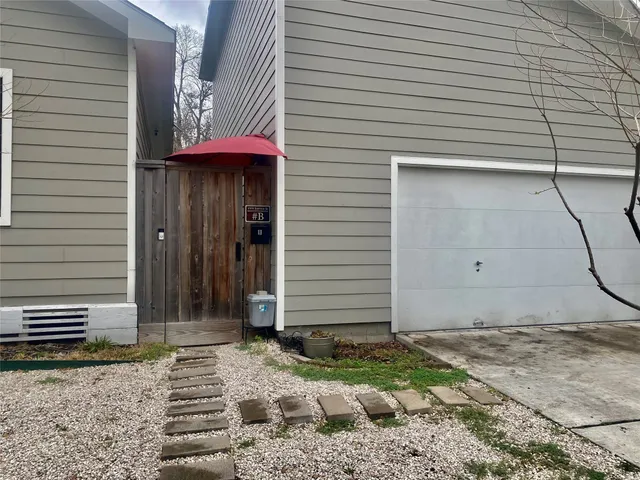 a potted plant sitting in front of a house