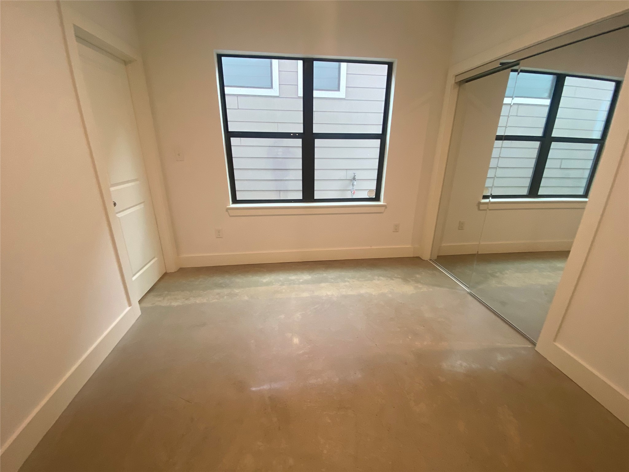 1555 Lawson Street, Unit B Houston, TX 77023 - Photo 5 of 8 an empty room with windows