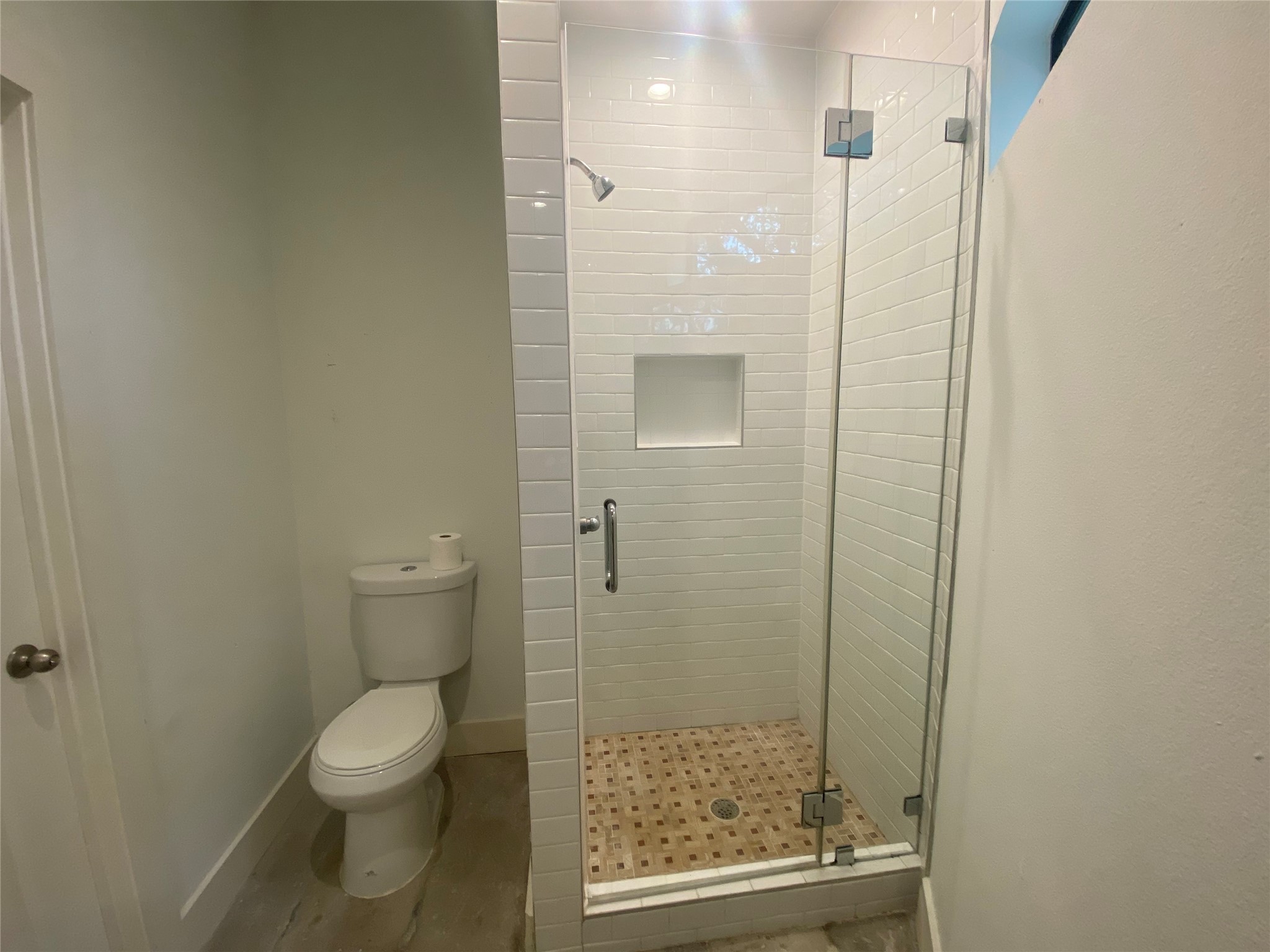 1555 Lawson Street, Unit B Houston, TX 77023 - Photo 7 of 8 a bathroom with a granite countertop shower and toilet
