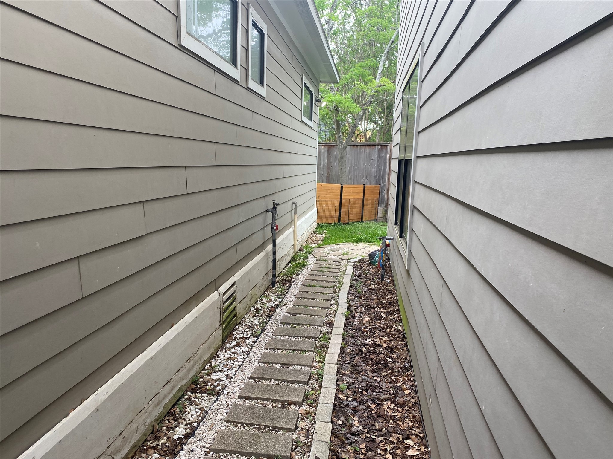 1555 Lawson Street, Unit B Houston, TX 77023 - Photo 8 of 8 a view of a pathway with a potted plant