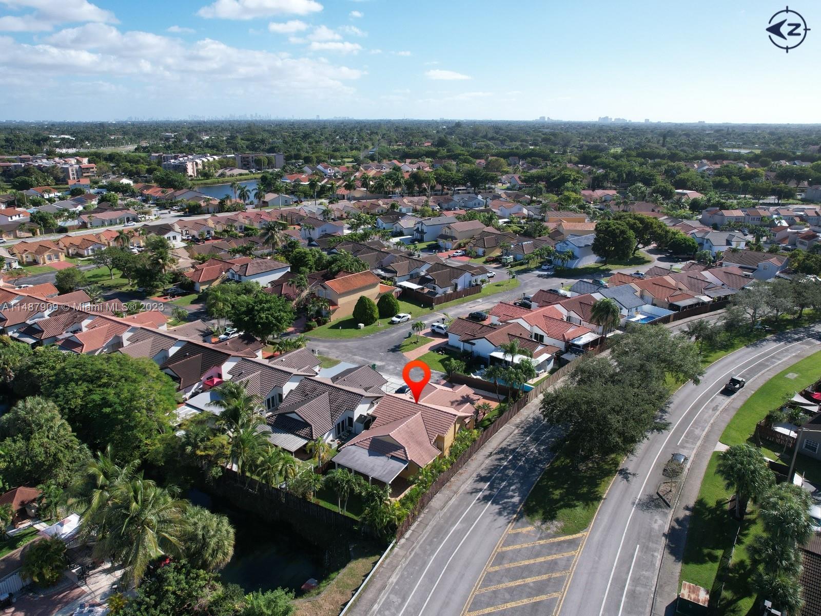 12913 Southwest 60th Street, Unit 12913 Miami, FL 33183 - Photo 14 of 17 an aerial view of residential houses with outdoor space