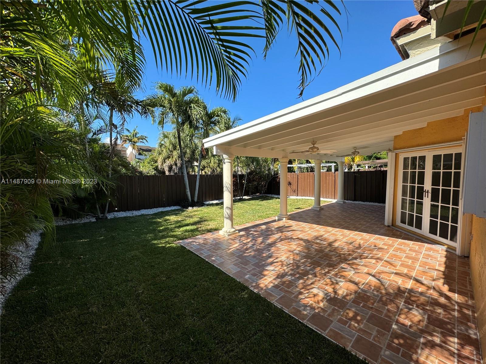 12913 Southwest 60th Street, Unit 12913 Miami, FL 33183 - Photo 3 of 17 a view of a backyard of the house