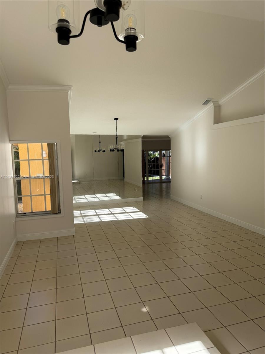 12913 Southwest 60th Street, Unit 12913 Miami, FL 33183 - Photo 5 of 17 a view of a livingroom and a window