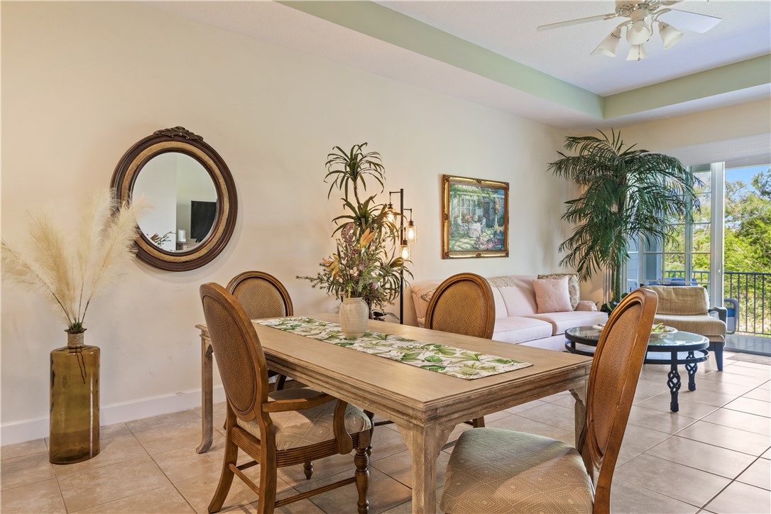 2340 Water Oak Court Southwest, Unit 223 Vero Beach, FL 32962 - Photo 12 of 36 a table and chairs in a patio