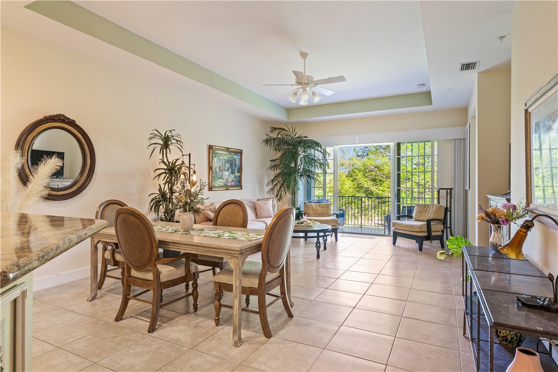2340 Water Oak Court Southwest, Unit 223 Vero Beach, FL 32962 - Photo 13 of 36 a view of a dining room with furniture window and outside view