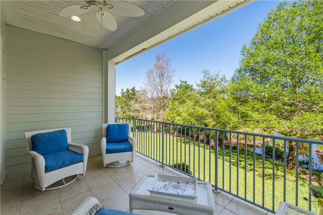 2340 Water Oak Court Southwest, Unit 223 Vero Beach, FL 32962 - Photo 19 of 36 a view of a chairs and table in the balcony