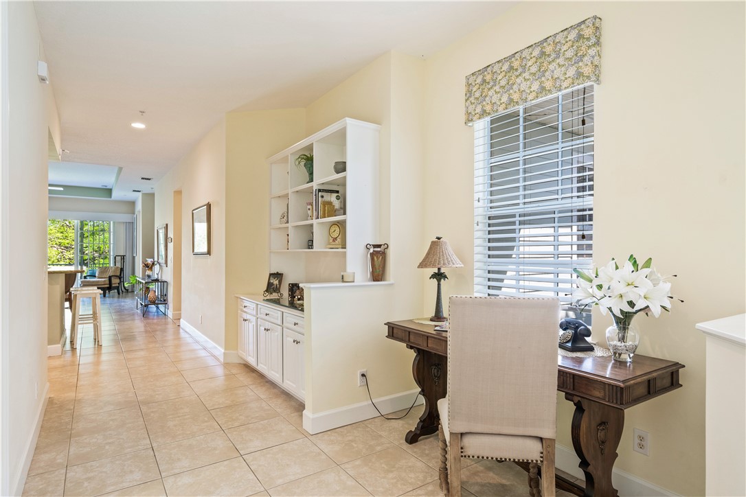 2340 Water Oak Court Southwest, Unit 223 Vero Beach, FL 32962 - Photo 23 of 36 a view of a dining room with furniture and a potted plant