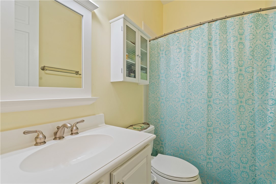 2340 Water Oak Court Southwest, Unit 223 Vero Beach, FL 32962 - Photo 26 of 36 a bathroom with a sink a toilet and shower