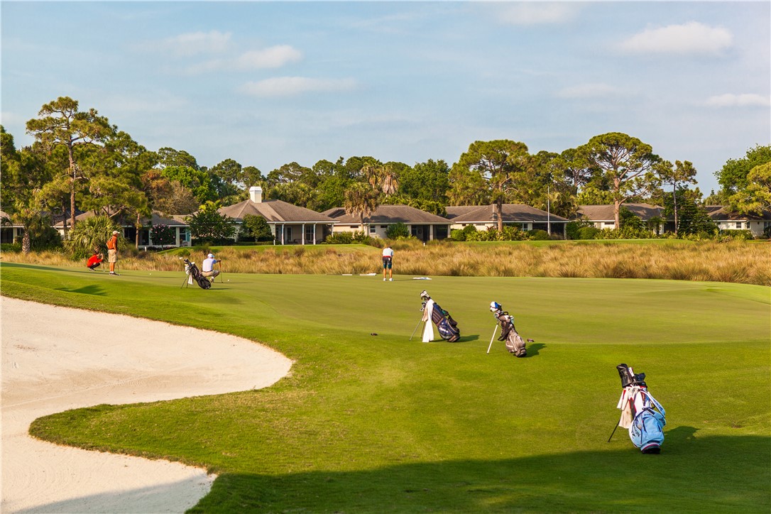 2340 Water Oak Court Southwest, Unit 223 Vero Beach, FL 32962 - Photo 36 of 36 a view of a lake with houses