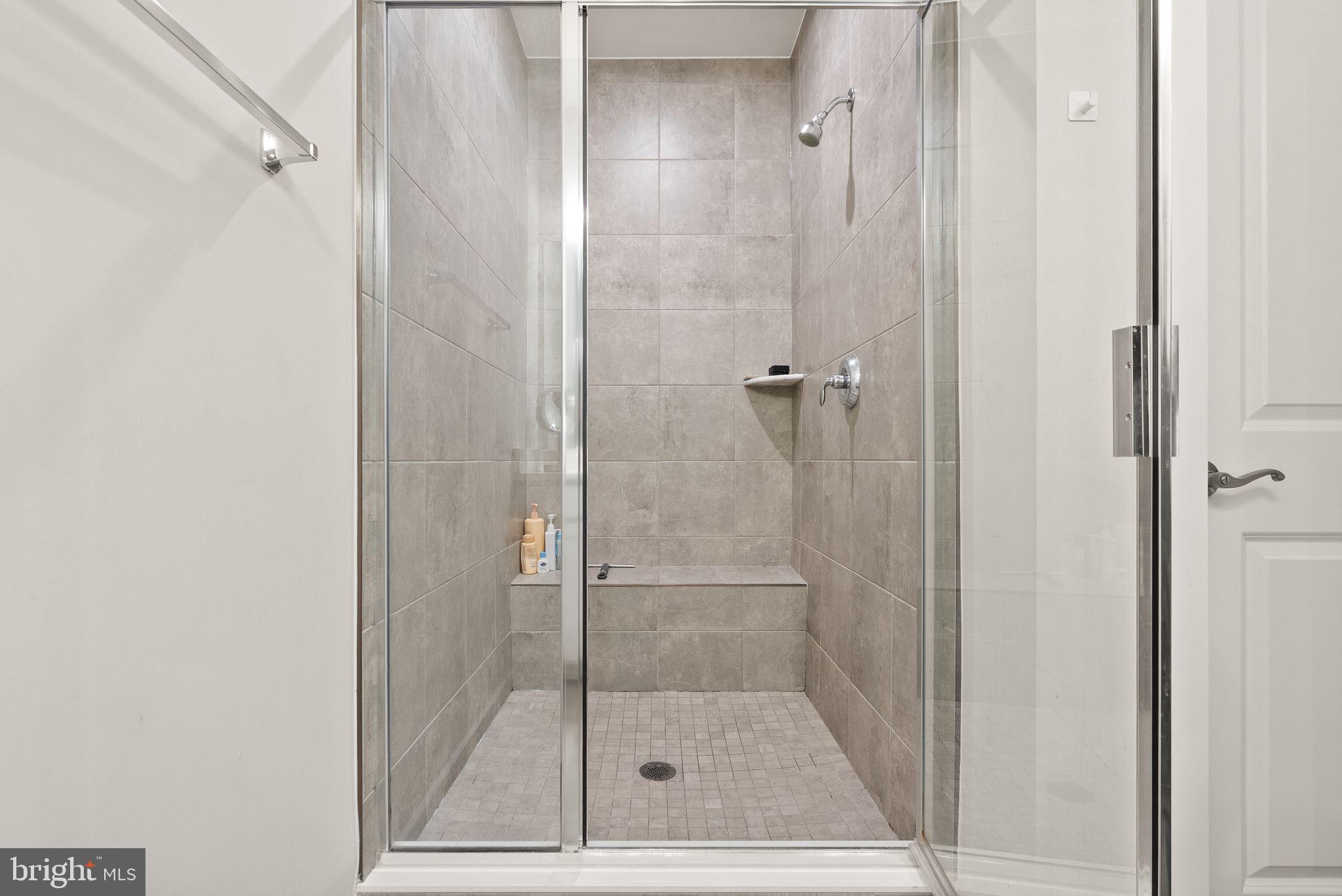 18353 Moss Garden Road Dumfries, VA 22026 - Photo 26 of 79 a bathroom with a shower