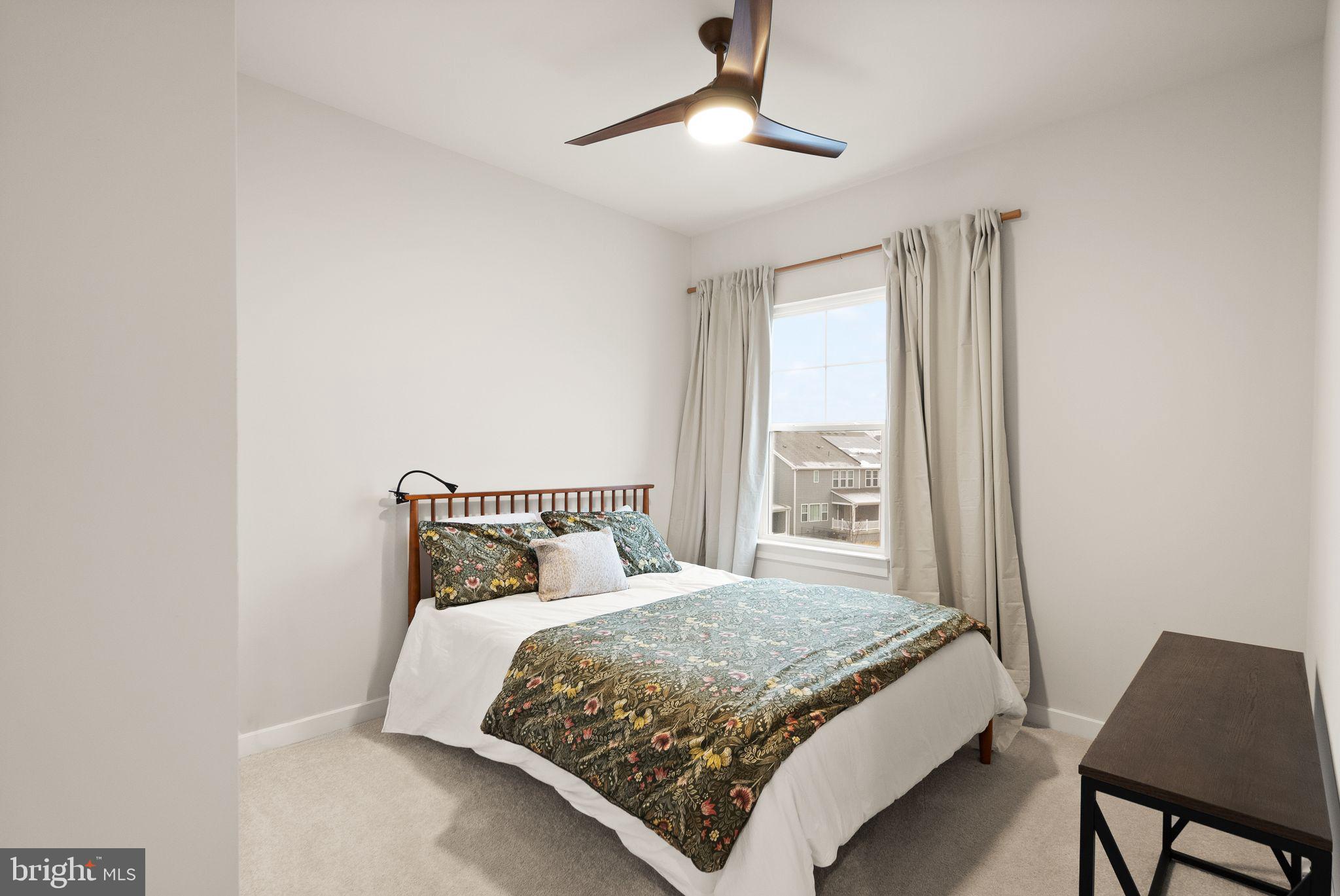 18353 Moss Garden Road Dumfries, VA 22026 - Photo 28 of 79 a bedroom with a bed and a window