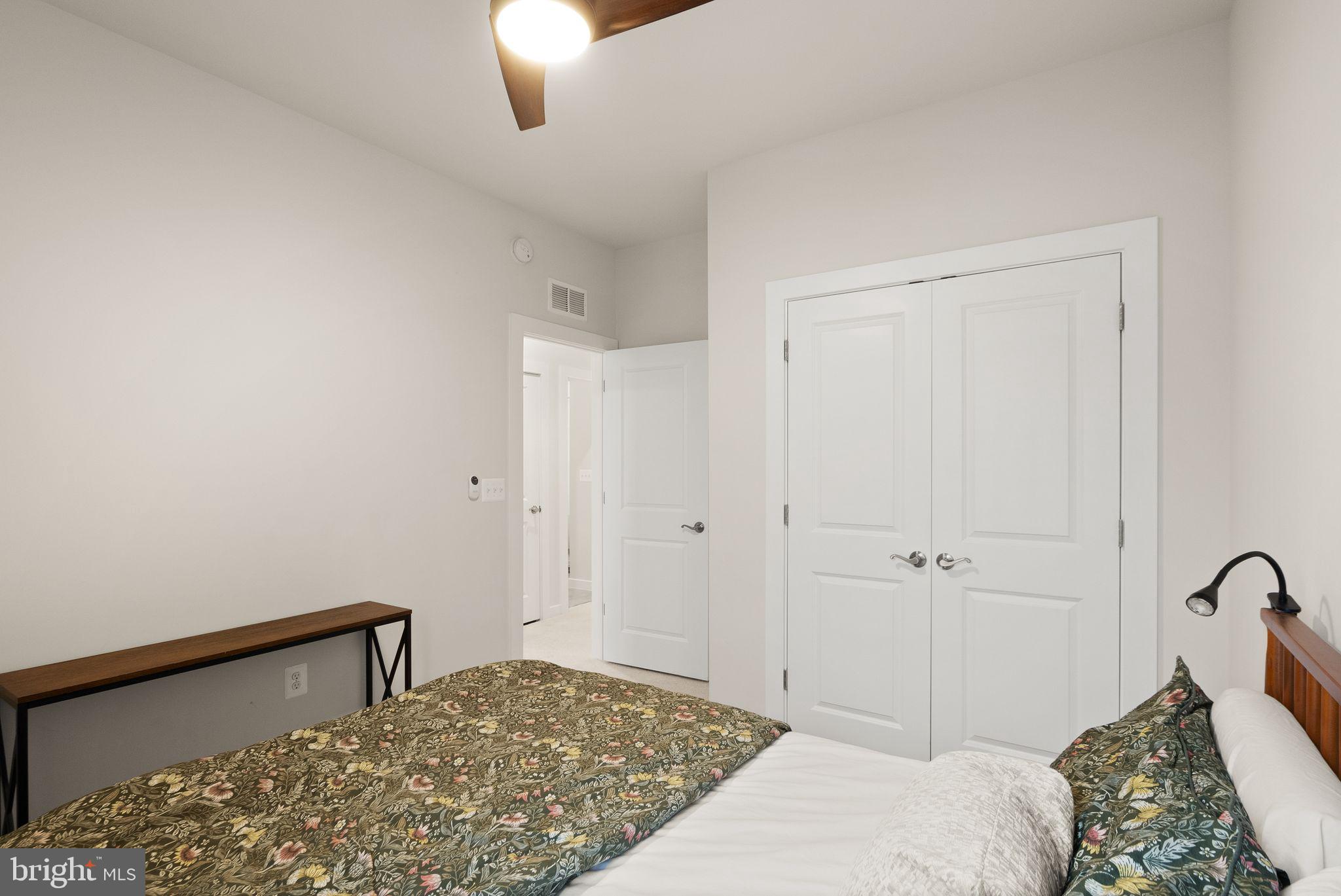 18353 Moss Garden Road Dumfries, VA 22026 - Photo 29 of 79 a bedroom with a bed and a dresser