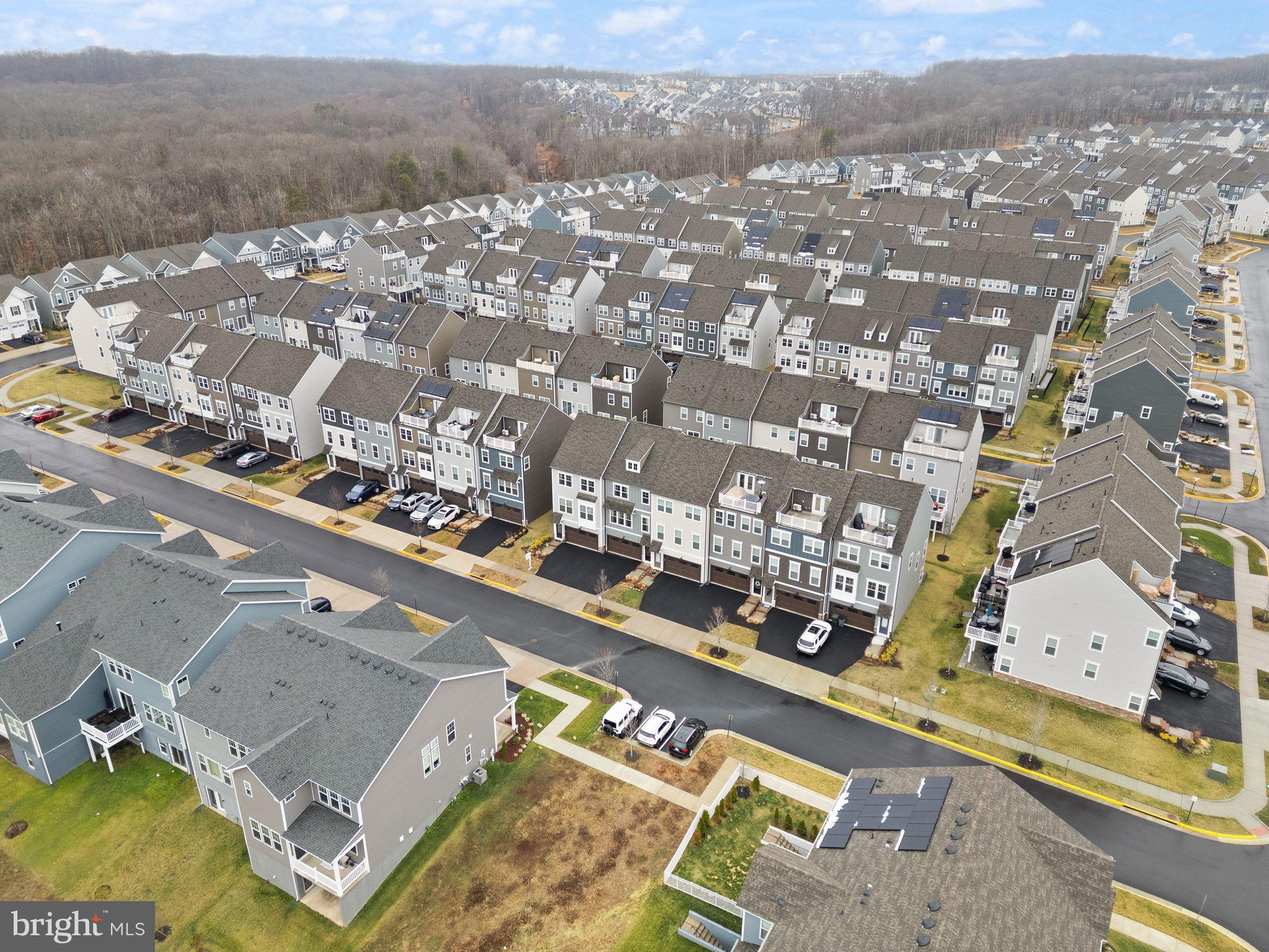 18353 Moss Garden Road Dumfries, VA 22026 - Photo 56 of 79 an aerial view of residential houses with outdoor space