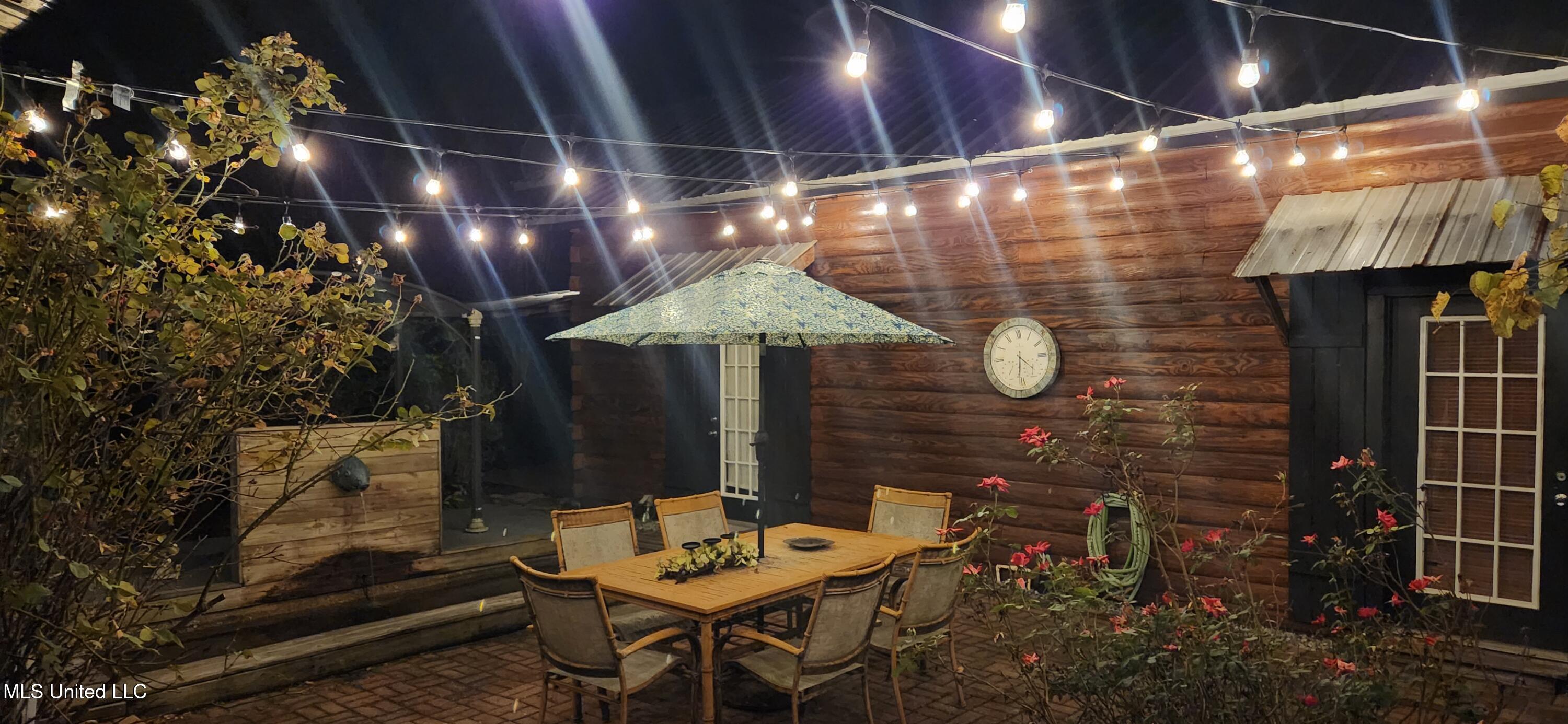 1815 Nicholson Avenue, Unit UPPER LOFT Waveland, MS 39576 - Photo 17 of 34 Courtyard at night