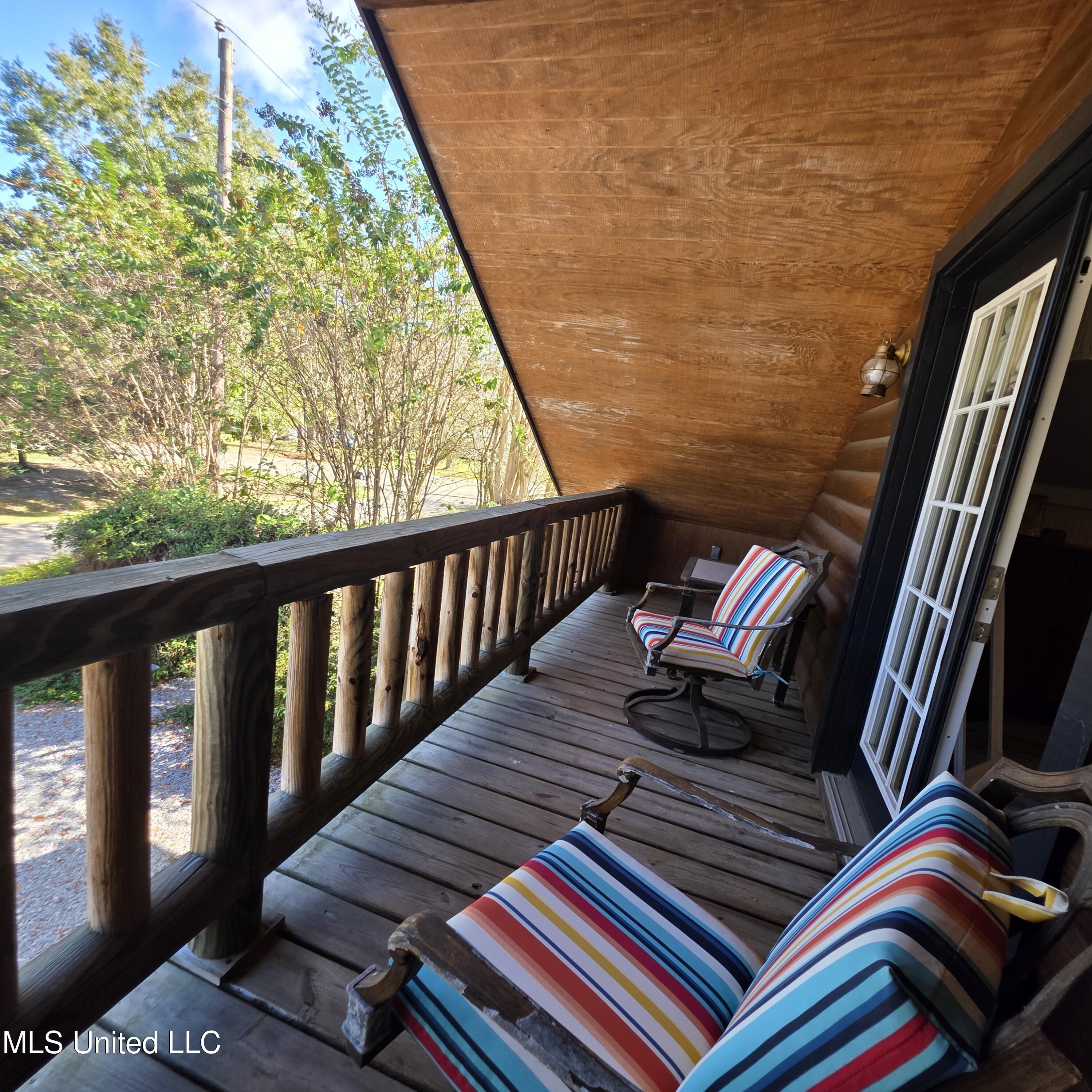 1815 Nicholson Avenue, Unit UPPER LOFT Waveland, MS 39576 - Photo 19 of 34 upper back porch