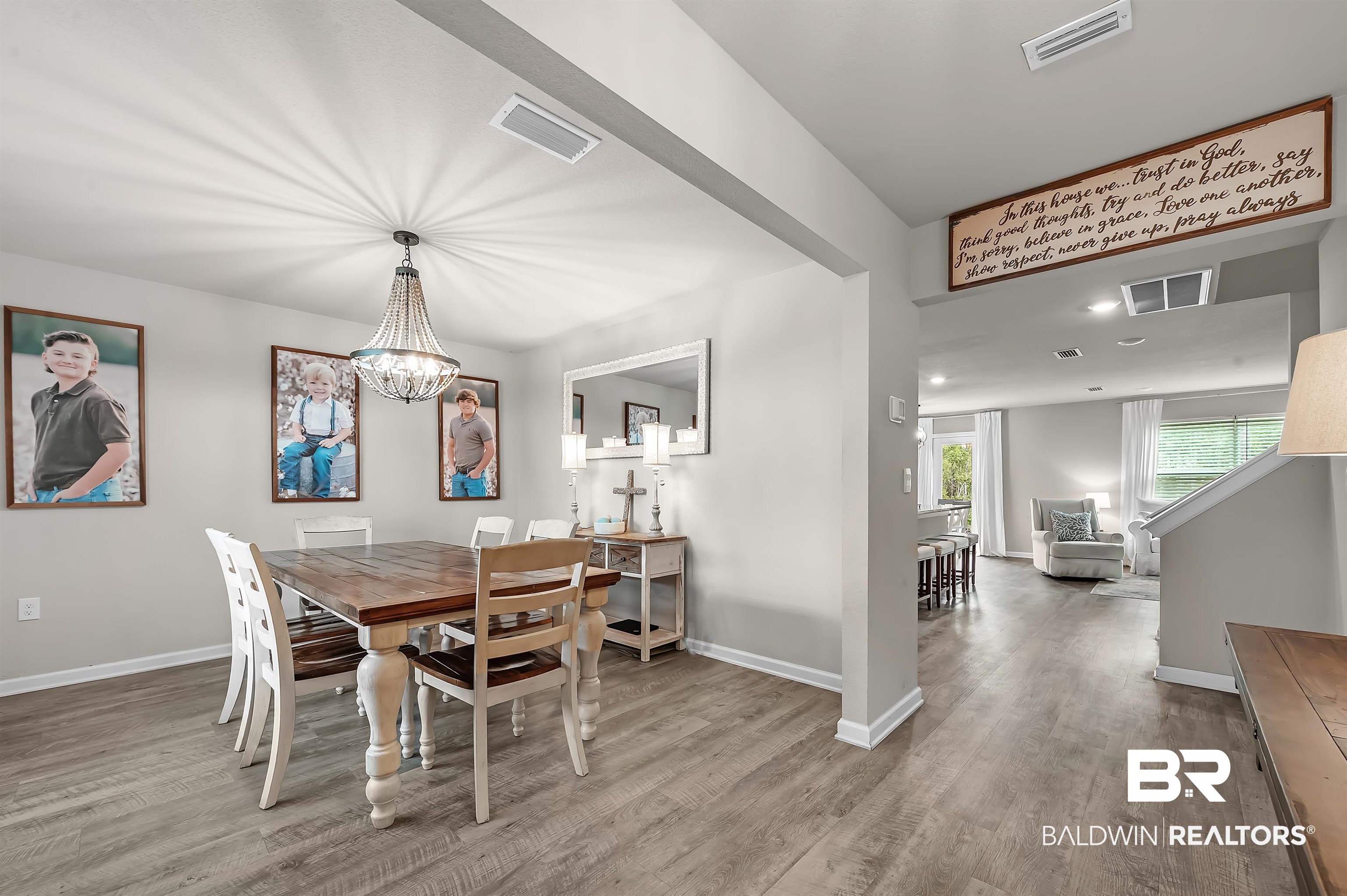 24549 Broken Sound Loop Orange Beach, AL 36561 - Photo 12 of 57 Dining area with wood-type flooring and a chandelier