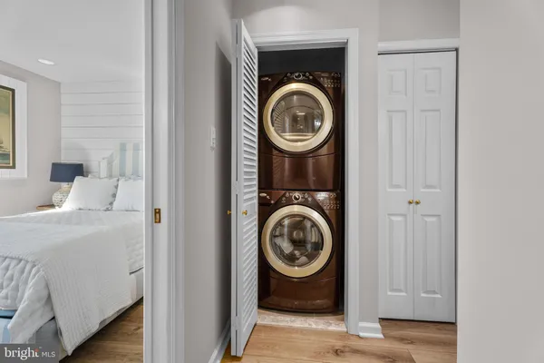 a kitchen with granite countertop a sink a counter top space appliances and cabinets