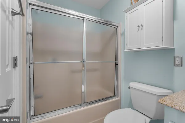 an aerial view of a house with a lake view