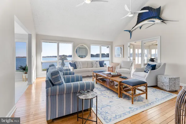 a bathroom with a granite countertop shower a sink and a stove
