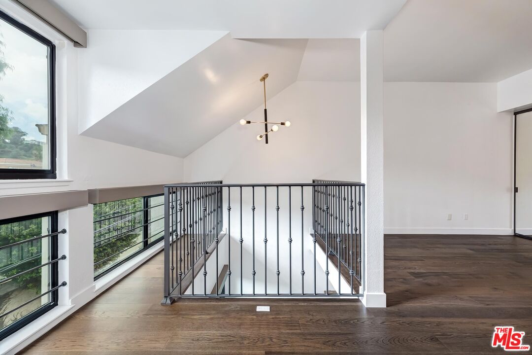10926 Bluffside Drive, Unit 20 Studio City, CA 91604 - Photo 17 of 31 a view of staircase with wooden floor and window