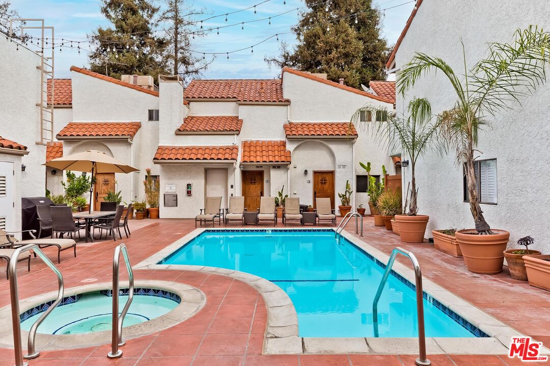 10926 Bluffside Drive, Unit 20 Studio City, CA 91604 - Photo 24 of 31 a swimming pool with outdoor seating and yard