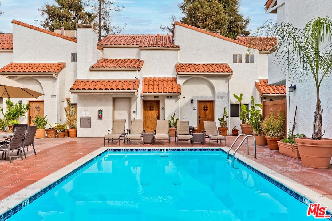 10926 Bluffside Drive, Unit 20 Studio City, CA 91604 - Photo 25 of 31 a view of a house with swimming pool and sitting area