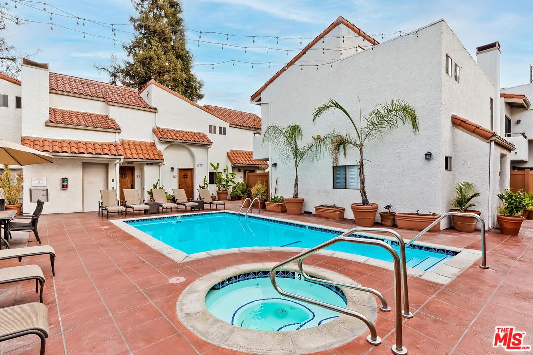 10926 Bluffside Drive, Unit 20 Studio City, CA 91604 - Photo 27 of 31 a swimming pool with outdoor seating and yard