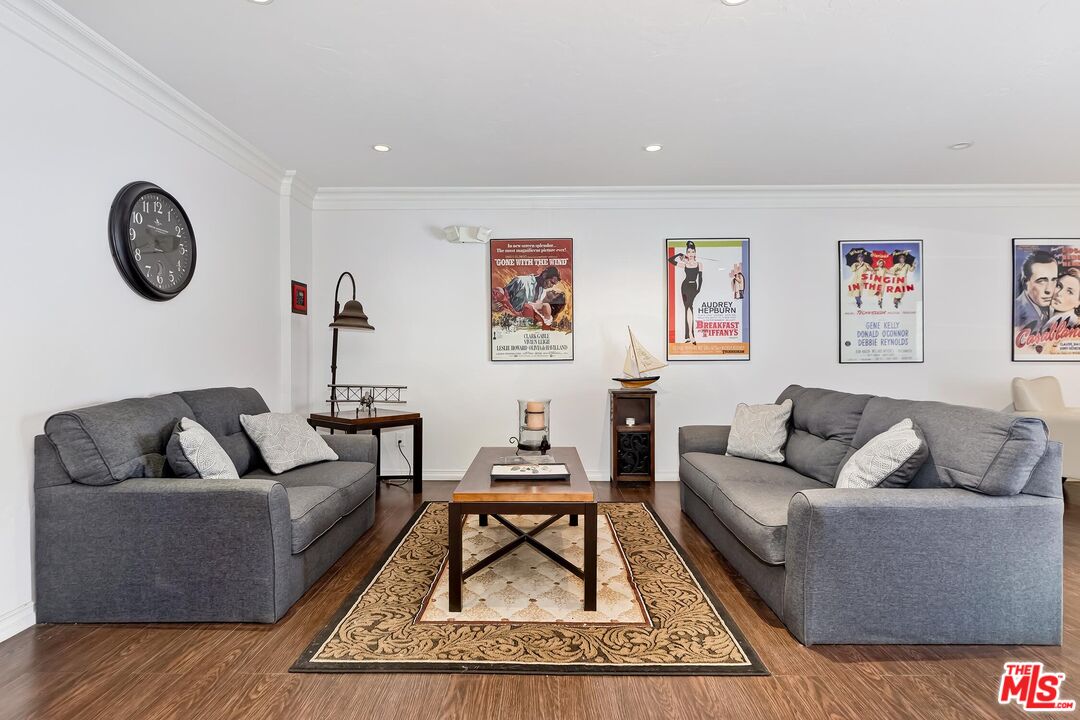10926 Bluffside Drive, Unit 20 Studio City, CA 91604 - Photo 31 of 31 a living room with furniture a rug and a wall