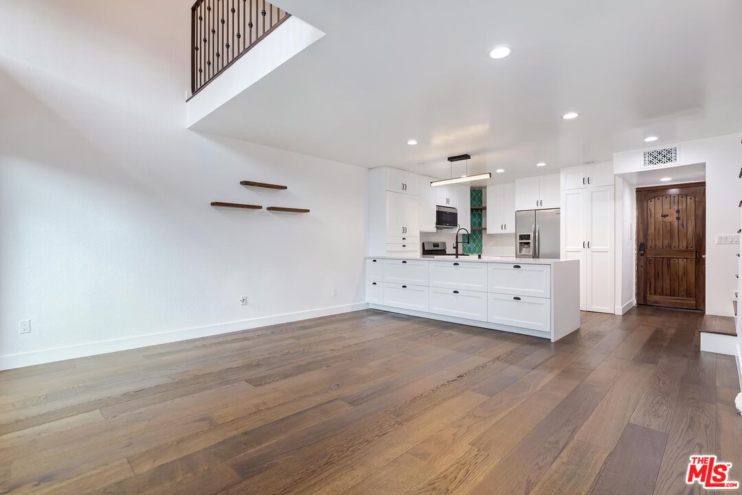 10926 Bluffside Drive, Unit 20 Studio City, CA 91604 - Photo 7 of 31 a view of a kitchen with wooden floor and a kitchen
