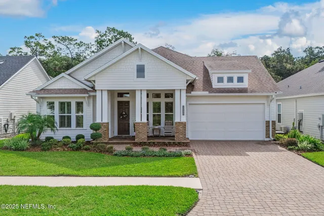 a front view of a house with a yard and porch