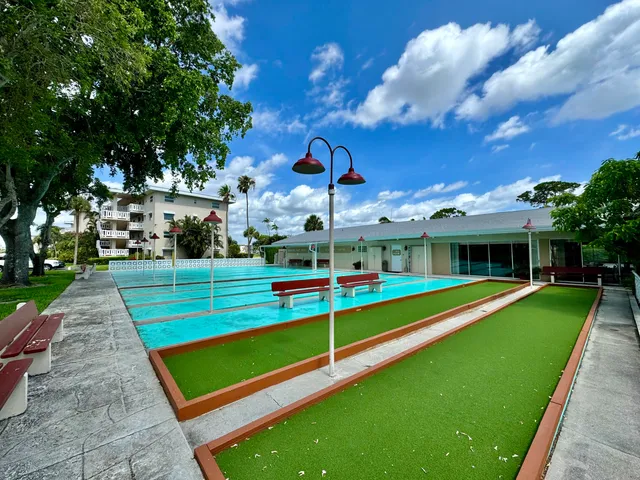 a view of a park with large trees
