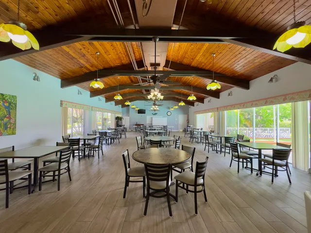 a dining area with furniture and wooden floor