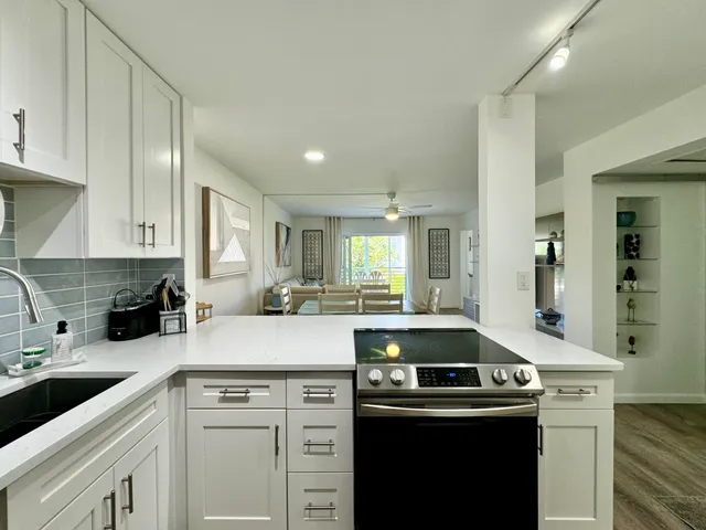 a kitchen with a sink and cabinets
