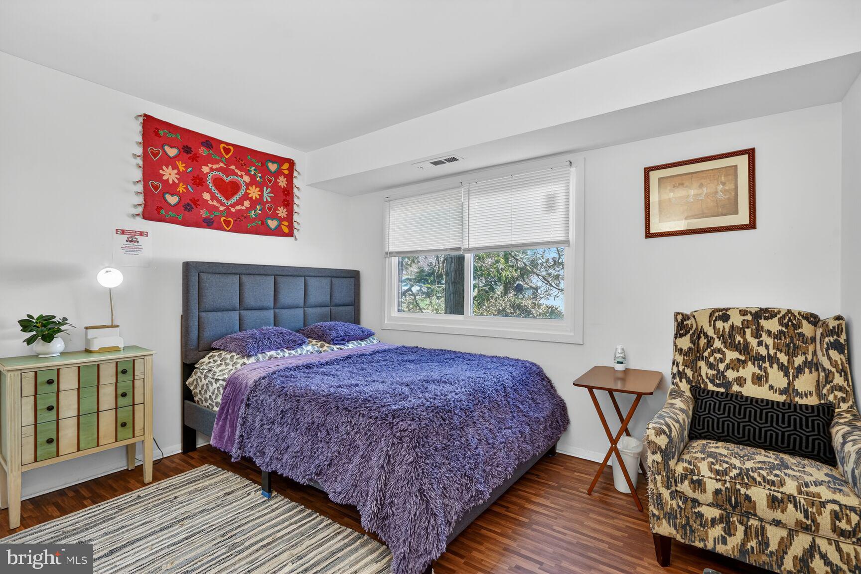 3850 Bel Pre Road, Unit 38504 Silver Spring, MD 20906 - Photo 6 of 15 a bedroom with a bed and window