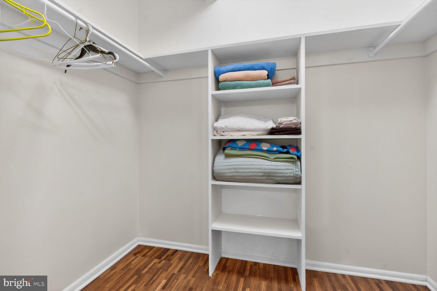 3850 Bel Pre Road, Unit 38504 Silver Spring, MD 20906 - Photo 10 of 15 a view of walk in closet with clothes and shoes
