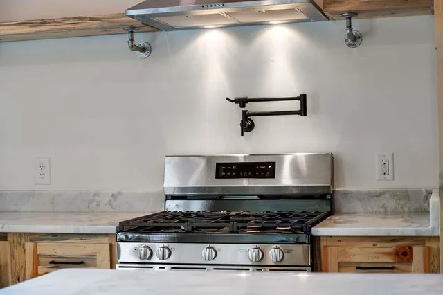 a bedroom with a bed and a fireplace