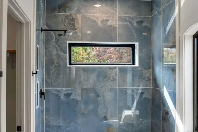 a living room with furniture a fireplace and wooden floor