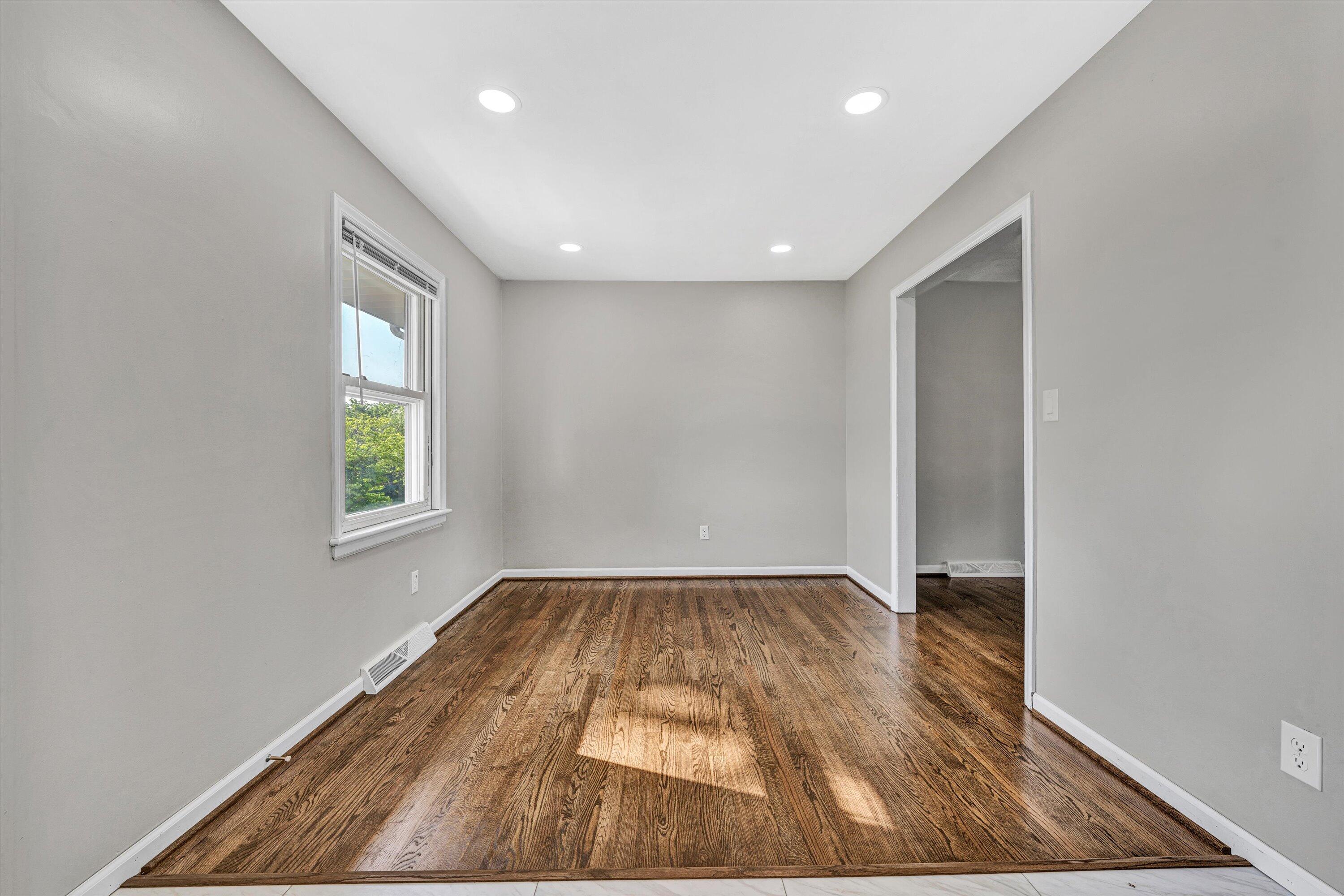 5225 Florist Road Roanoke, VA 24012 - Photo 11 of 38 an empty room with wooden floor and windows