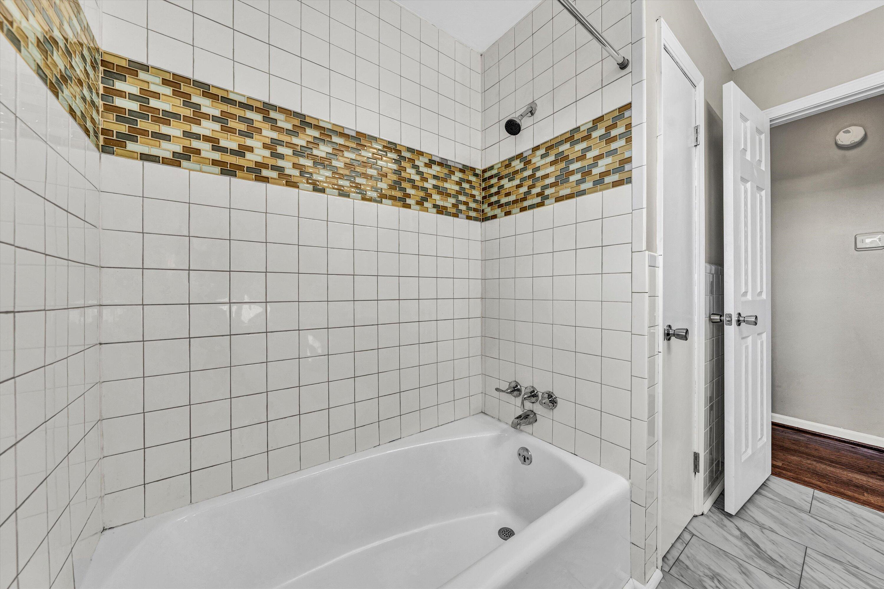 5225 Florist Road Roanoke, VA 24012 - Photo 14 of 38 a bathroom with a bathtub and shower