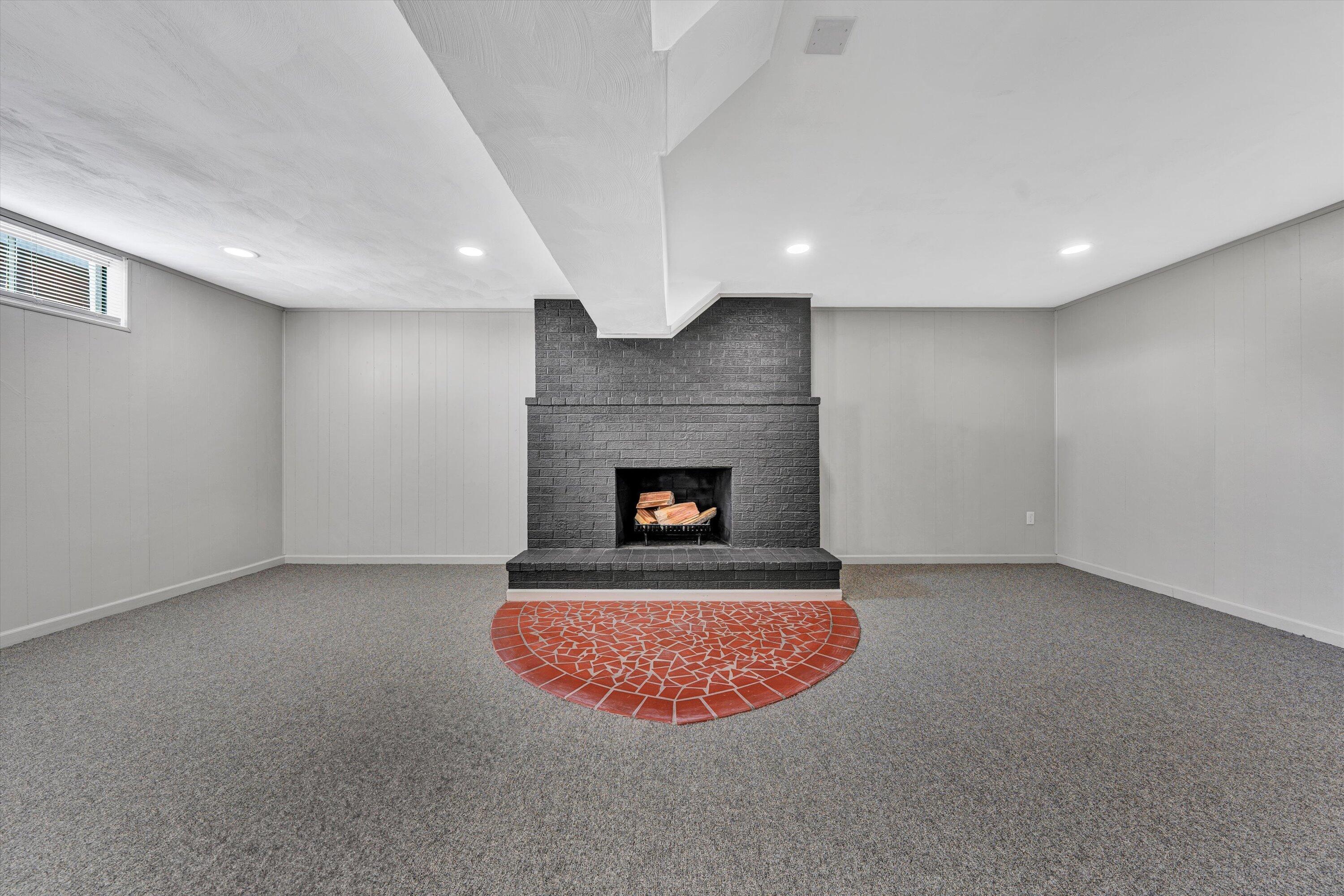 5225 Florist Road Roanoke, VA 24012 - Photo 18 of 38 an empty room with a fireplace