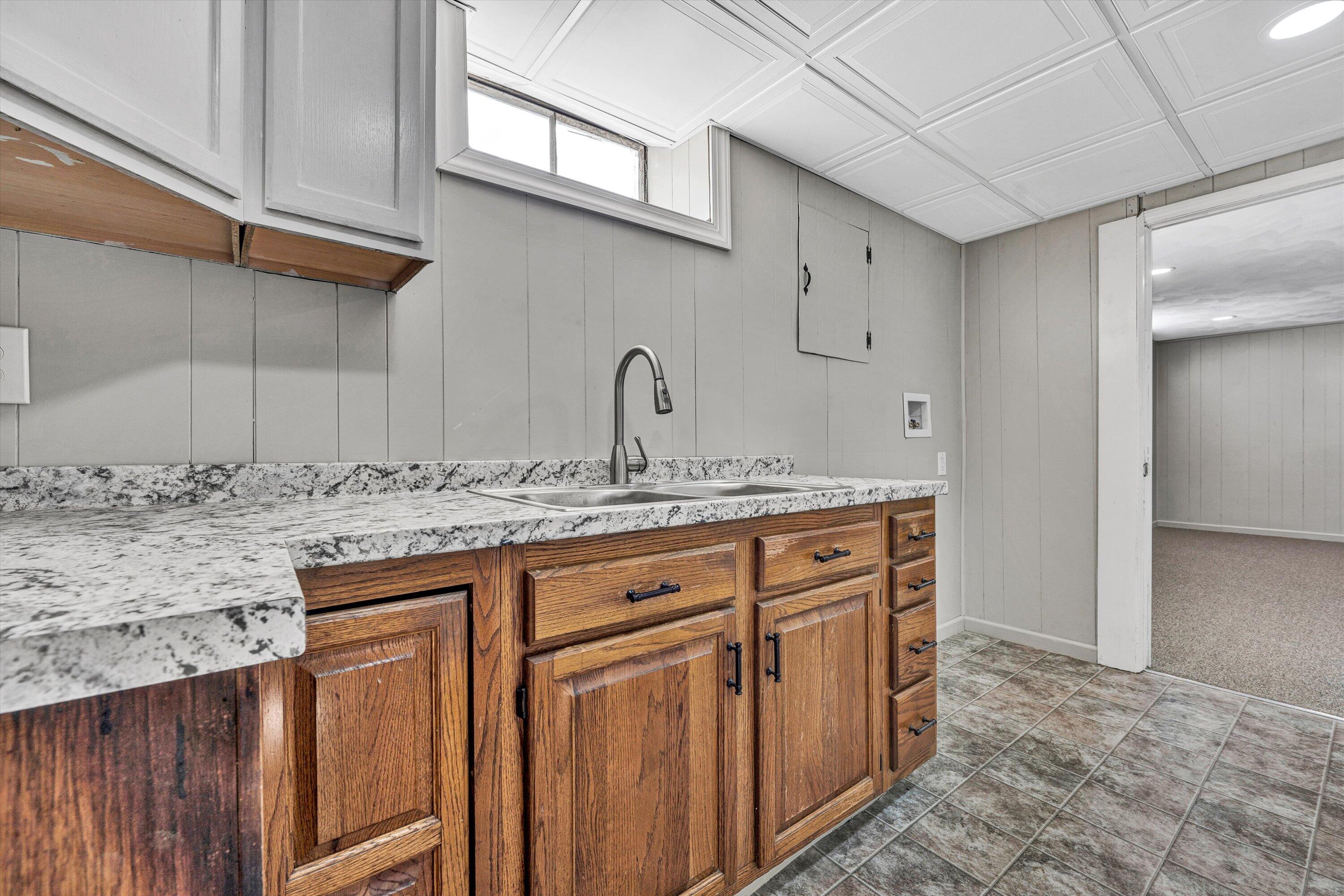 5225 Florist Road Roanoke, VA 24012 - Photo 21 of 38 a bathroom with a granite countertop sink and a mirror