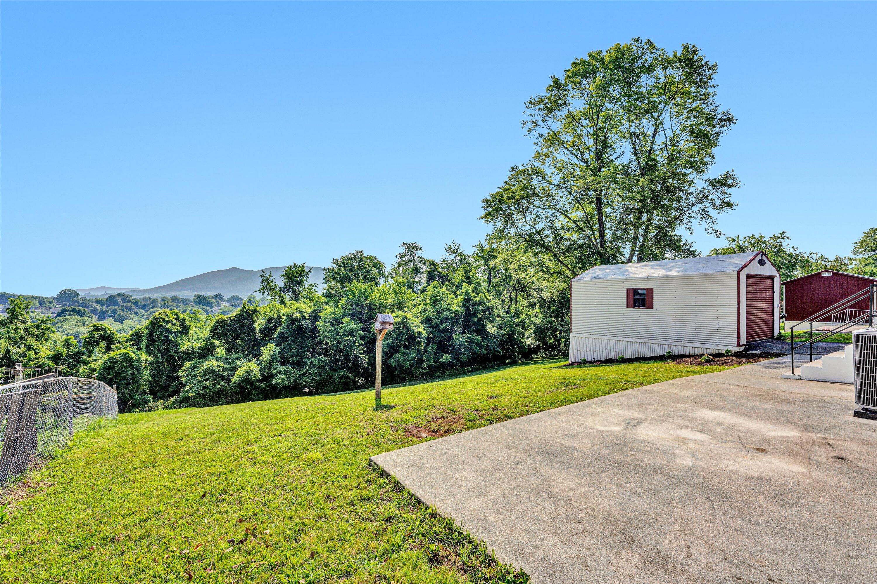 5225 Florist Road Roanoke, VA 24012 - Photo 33 of 38 a house with trees in the background